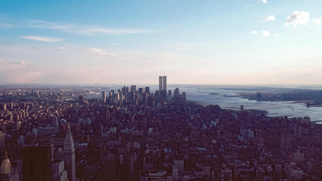 The New York City skyline as it appeared before September 11th, 2001, featuring the World Trade Center's Twin Towers on a clear day.