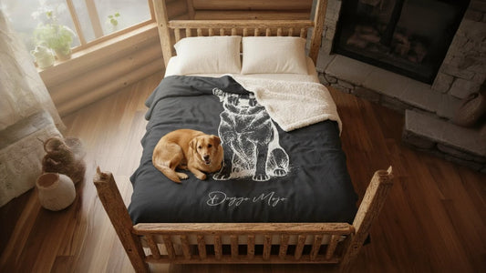 A golden mixed-breed dog curled up on a boutique Mojo Originals Sherpa blanket with a minimalist "Modern Sketch" design. The scene is set in a rustic cabin bedroom with warm, natural lighting, highlighting the plush texture of the blanket.